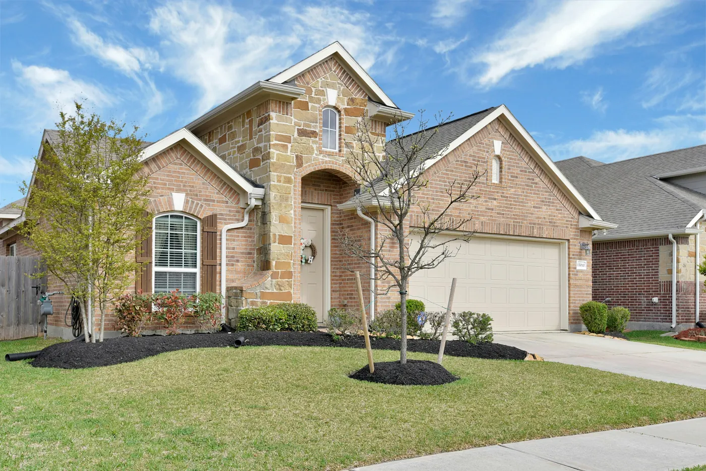 Stone and brick residential home photographed for a real estate listing